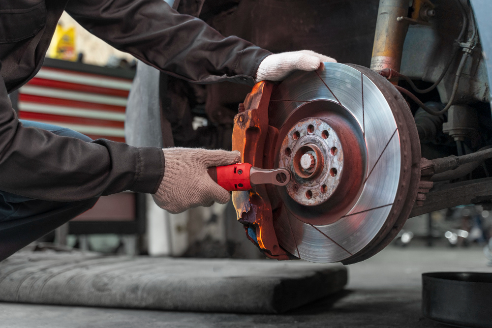 New brake pads being fitted during brake replacement service in Northern Beaches
