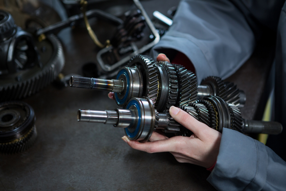 Mechanic inspecting worn clutch components during vehicle service in Northern Beaches workshop.